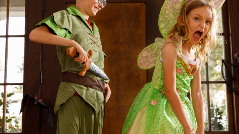 A boy dressed up as Peter Pan and a girl dressed up as Tinker Bell.