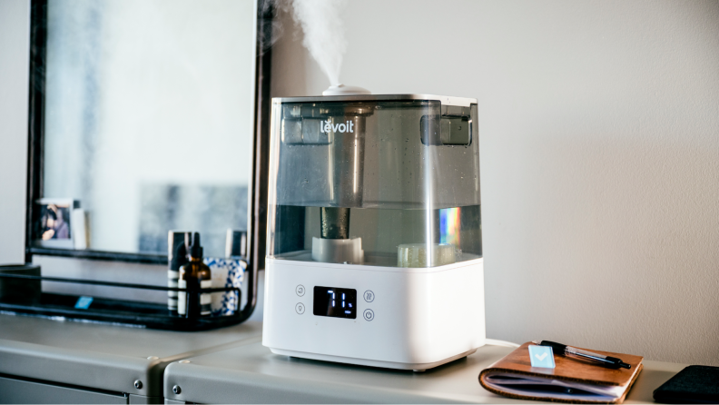 The Levoit Classic 300S emitting moisture on a counter