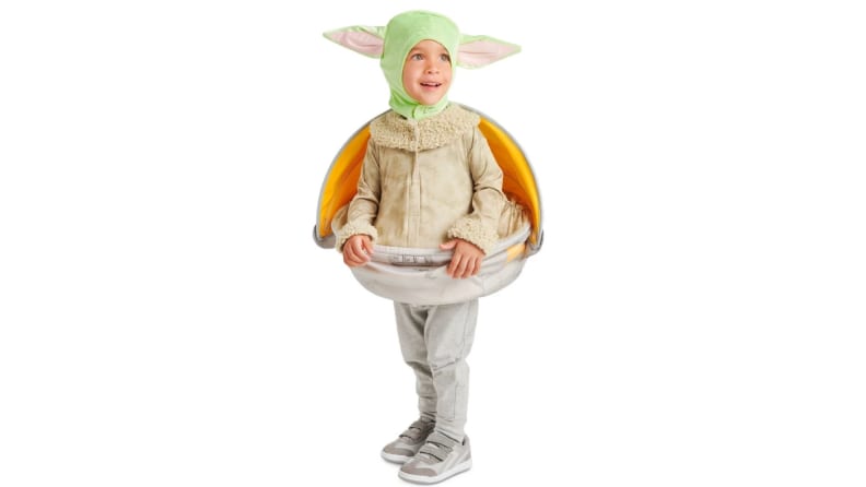 A child in a Baby Yoda costume.
