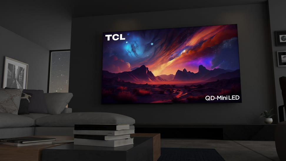 The 115-inch TCL QM89 mini-LED TV displaying colorful, abstract imagery in a modern living room setting