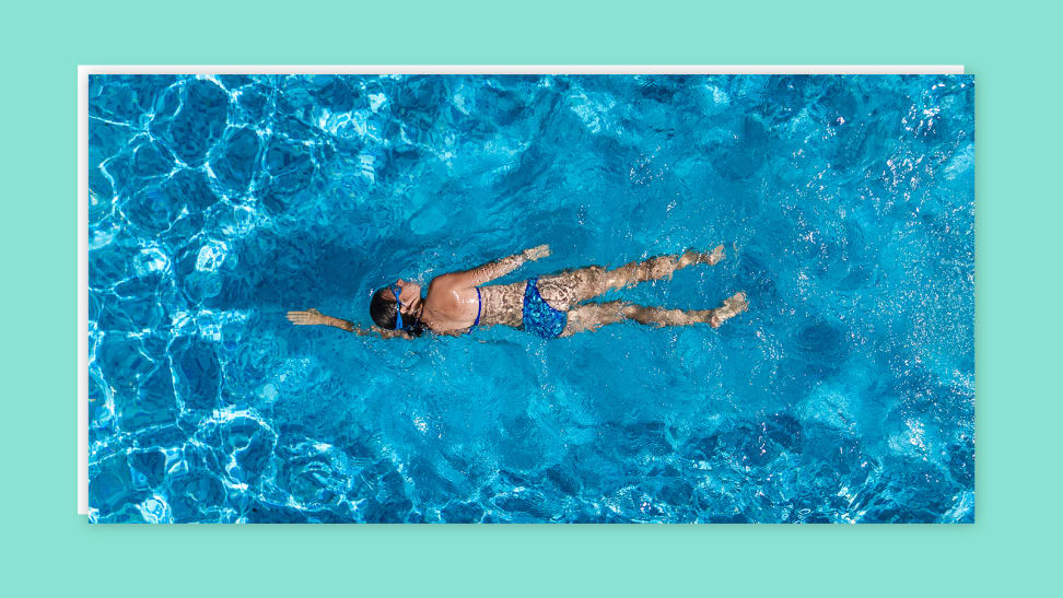 Person swimming in pool.