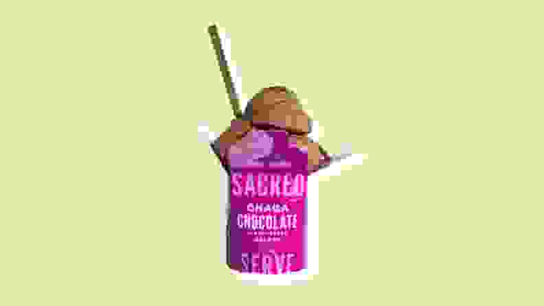 A pink and white container of Scared's Chaga Chocolate plant-based gelato with a lime/yellow background.