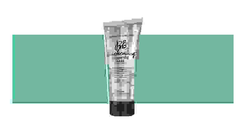 Tube of Bumble and Bumble Thickening Plumping Mask on a green background.