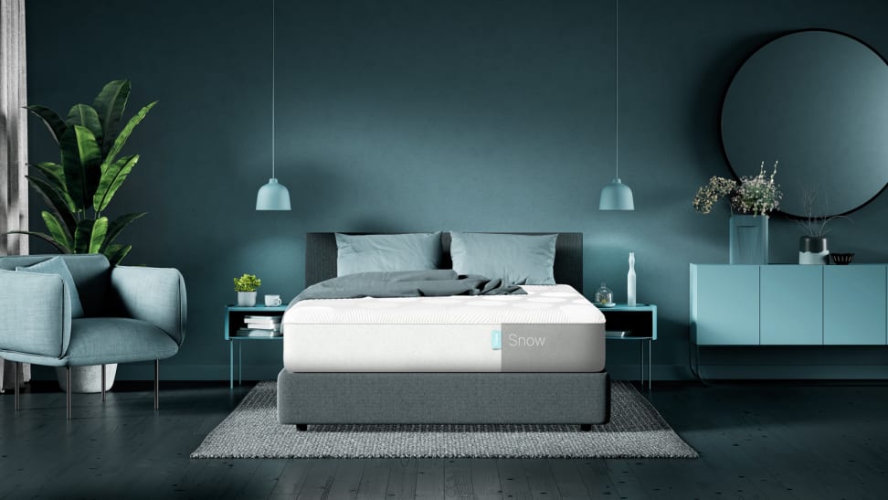 The Casper Snow mattress in a blue bedroom