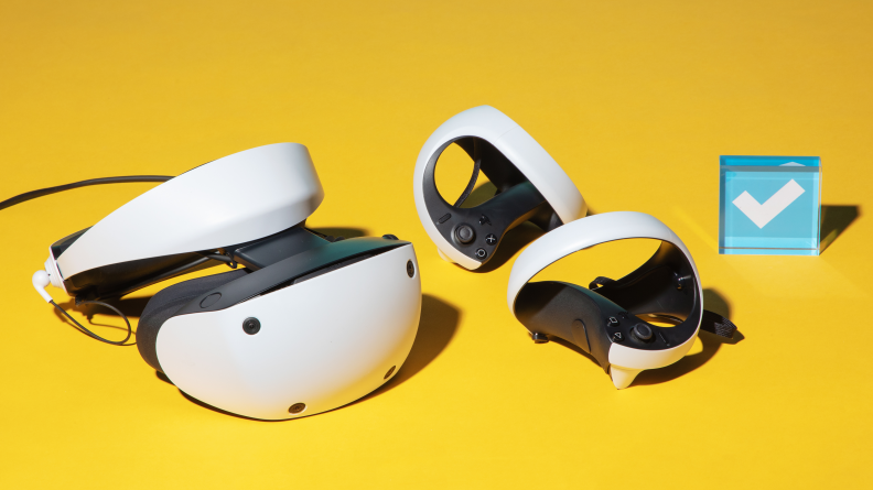A white VR headset and controllers on a yellow background