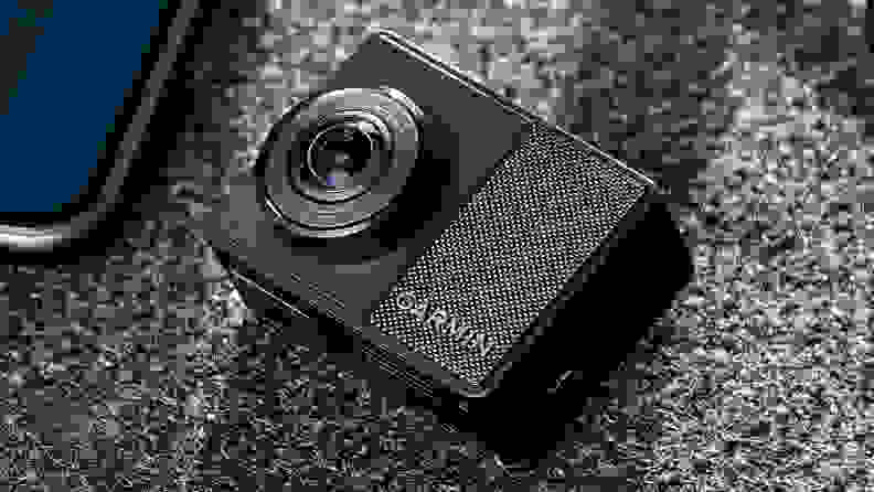 A Garmin 67W dash cam sits on a grey background