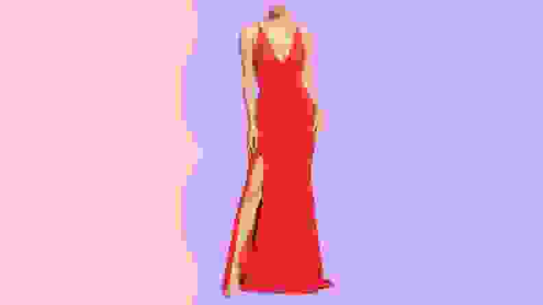 A long red fitted wedding dress with a slit.