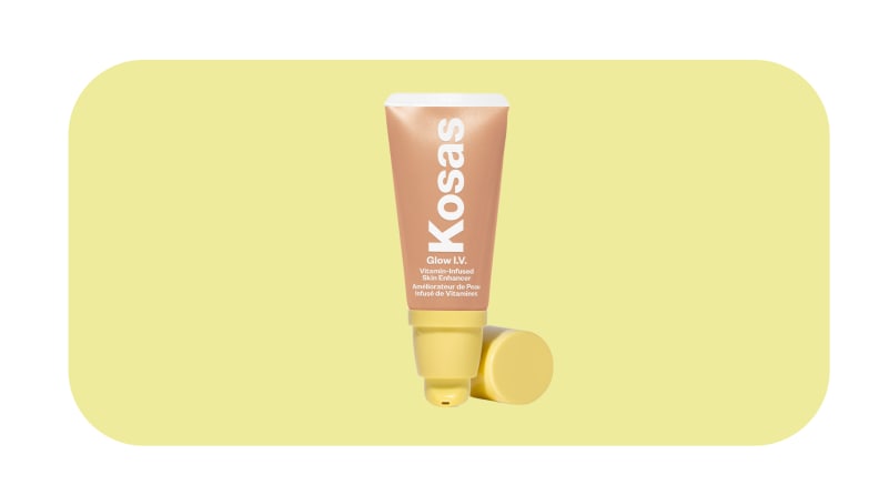 Kosas illuminator against a yellow background.