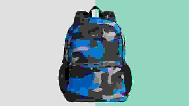 A State Kane backpack in blue camo color against a peach and green background.