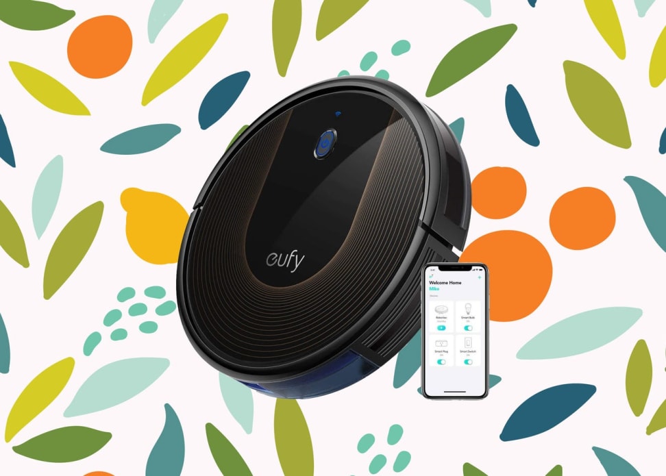 Sleek black robot vacuum against a colorful background