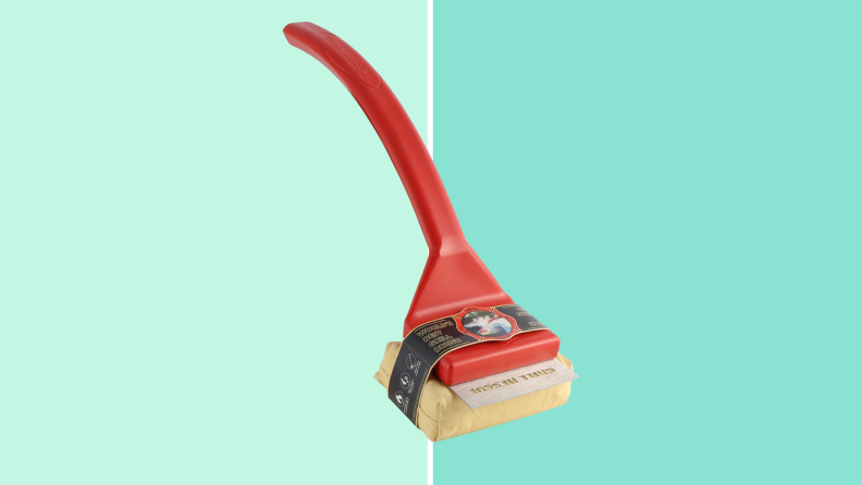 A Grill Rescue Brush against a teal background.