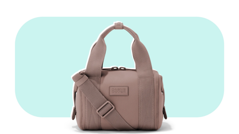 A rose-colored neoprene duffel bag with an extra strap.