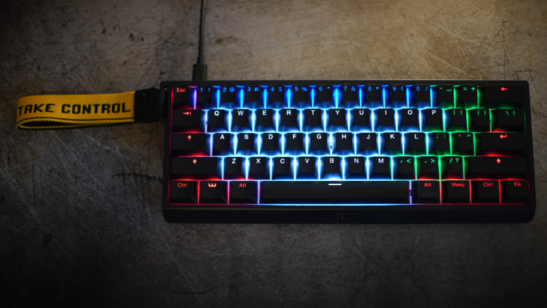 Shot of the Wooting 60he keyboard with rainbow backlit display turned on.