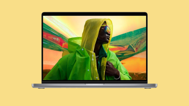 A 2021 MacBook Pro on a yellow background.