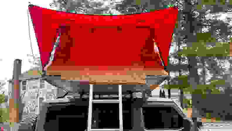 Profile of the Rugged Ridge Roof Top Tent set up over a gray Jeep Wrangler Rubicon.