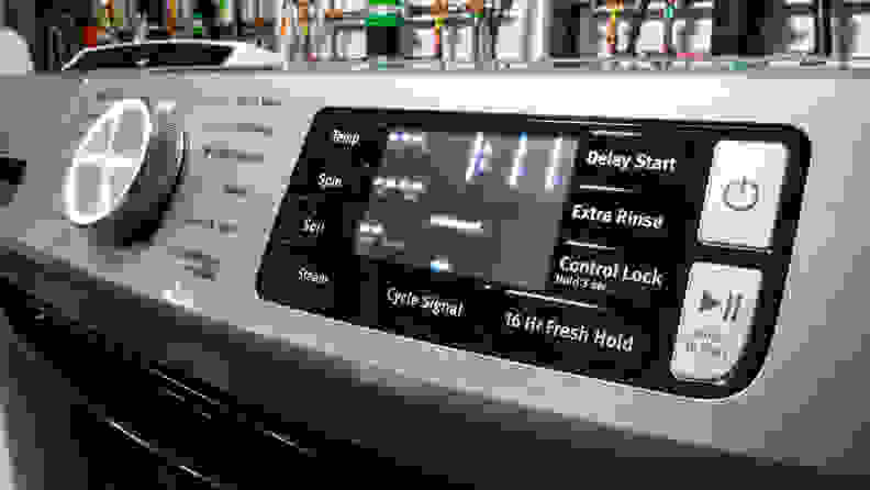The control panel of the Maytag MHW6630HC front-load washer. Next to a giant cycle selection dial that reads, in all-caps, "EXTRA POWER," is a touch panel with more nuanced controls like temperature and water level selection.