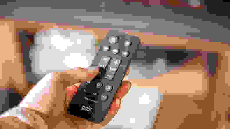 holding the Signa S4 soundbar remote