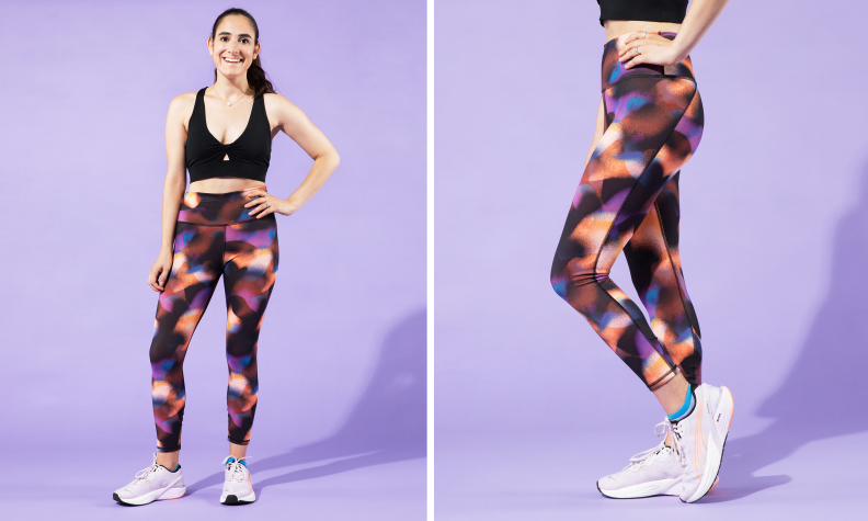 A woman posing in Fabletics leggings.