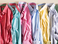 Pile of wrinkled dress shirts in a rainbow of colors