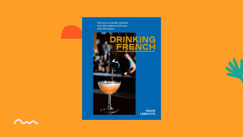 Drinking French cookbook against a bright orange background.
