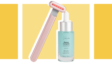 Red light therapy wand next to bottle of skin serum.
