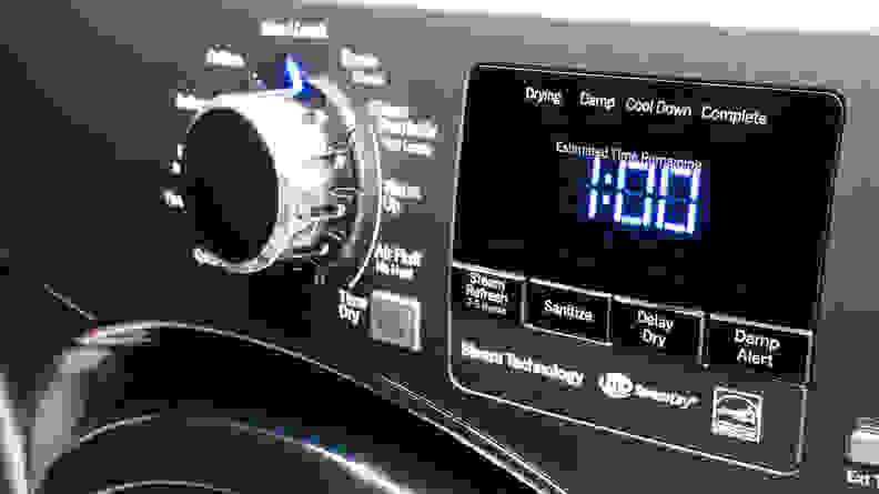 A close-up of the GE GFD45ESPM1DG dryer's control panel, which consists of a cycle-selection dial next to an LED display panel that's surrounded with cycle option buttons.