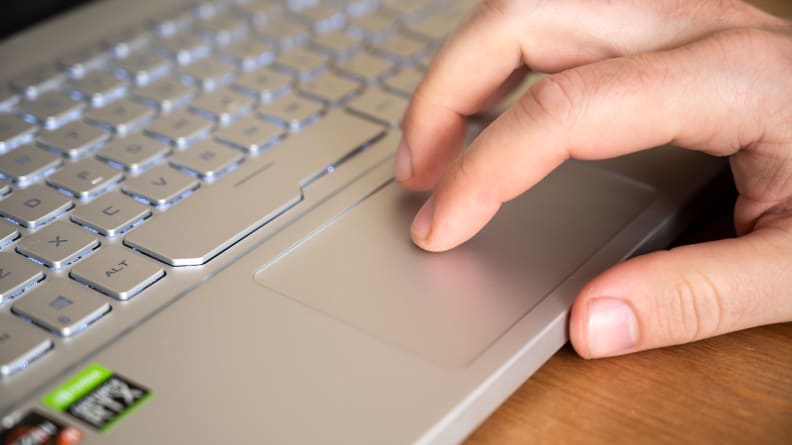 A person using the trackpad