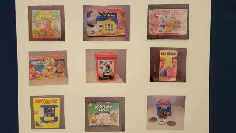 Children's choice board with picture illustrations of sensory toys attached.