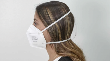 A person wears a protective mask against the spread of COVID-19.