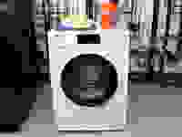 The Miele WWD660WCS Washing Machine in the Reviewed Labs with a box of Tide pods on top.