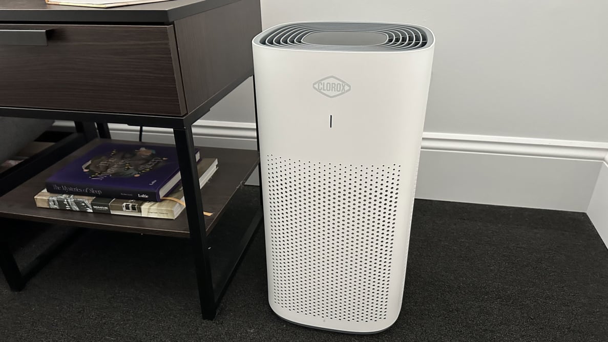 The Clorox 11010 Large Room True HEPA Air Purifier on the corner of a living room.