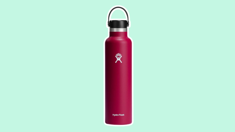 A red, Hydro Flask bottle on a mint green background.