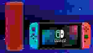 蓝色背景下的便携式蓝牙扬声器和任天堂Switch。