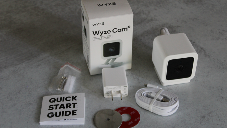 Wyze Cam V3 security camera unassembled next to box packaging.