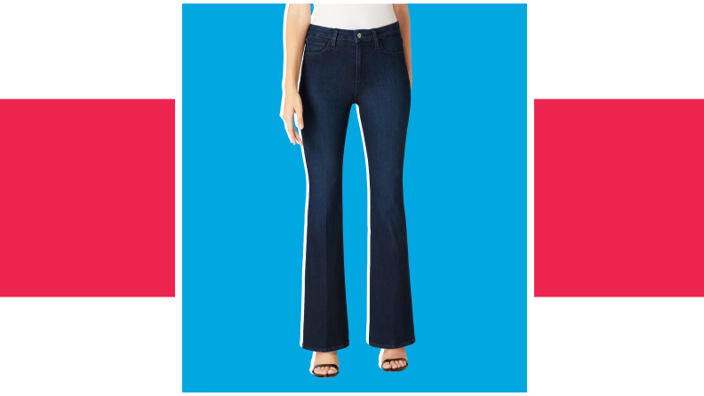 A model wears dark blue denim high-waisted bell bottom pants.