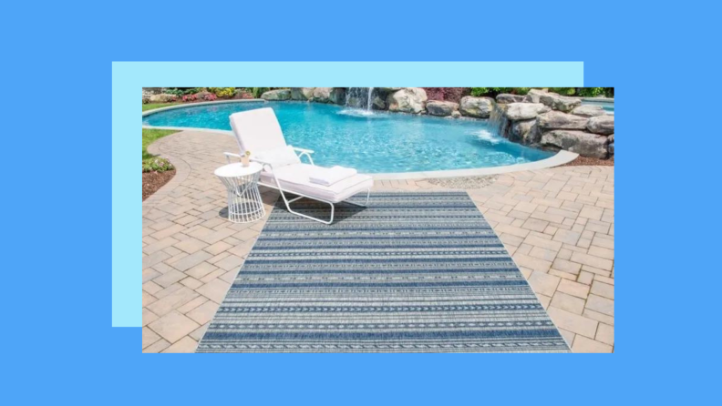 A blue rug on a pool deck against a blue background.