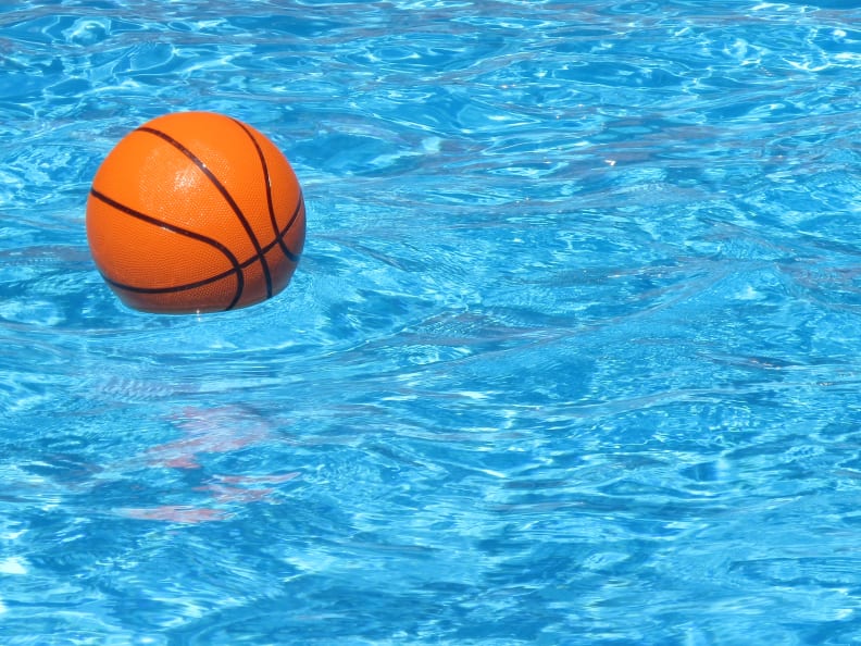 A water basketball floats in a pool.