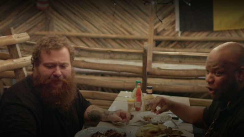 A still of Action Bronson and Big Body eating together in Jamaica.