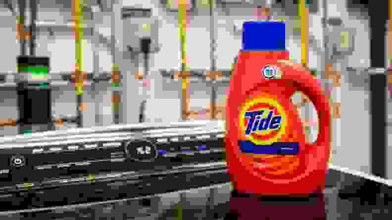 Tide HE detergent atop a washer.