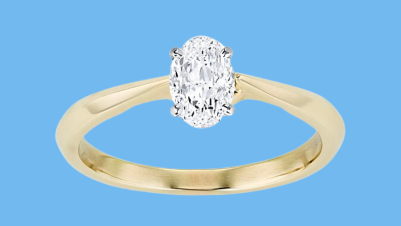 An image of an angular diamond engagement ring in gold.