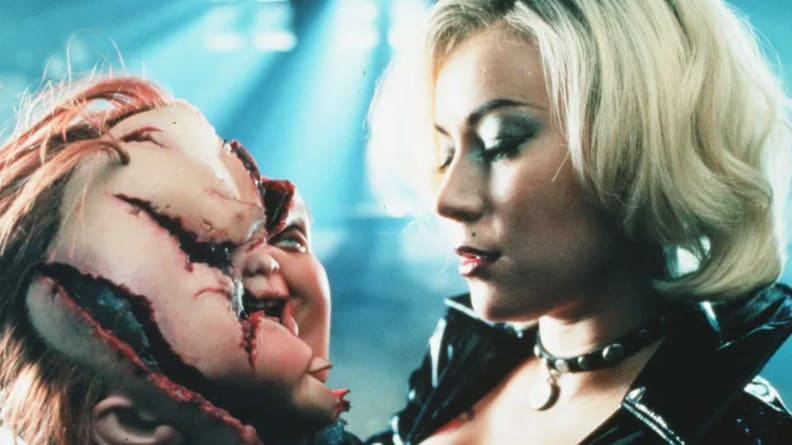 Jennifer Tilly and Chuck head doll in a scene from "Bride of Chucky."