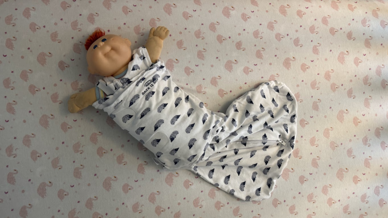 Cabbage Patch doll wrapped in a Halo Sleepsack.
