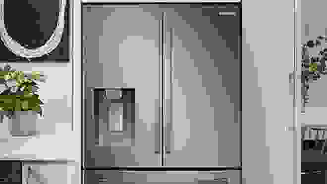 Stainless steel double door refrigerator in kitchen