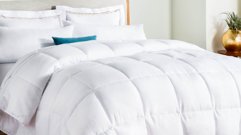 A bed with white bedding