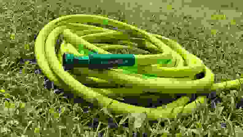 The Flexzilla garden hose sits on the grass