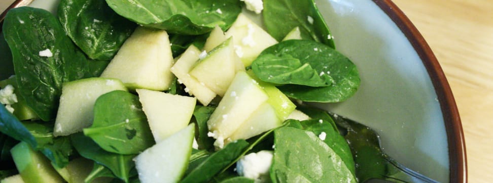 Photo of a spinach and apple salad.