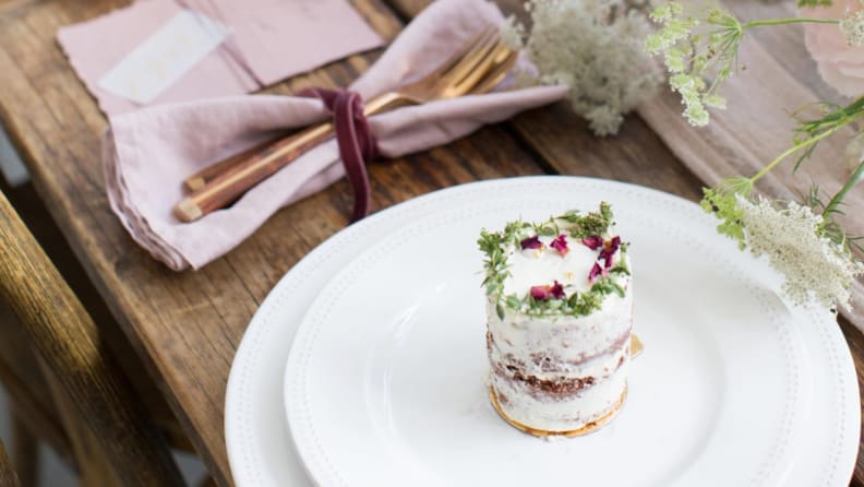 a tablescape with a miniature cake on a plate