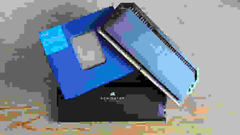 A small blue box in between two black sticks of desktop computer RAM.