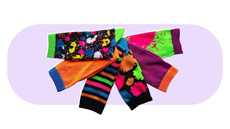 Multicolored, patterned calf-length socks gathered in sem-circle.