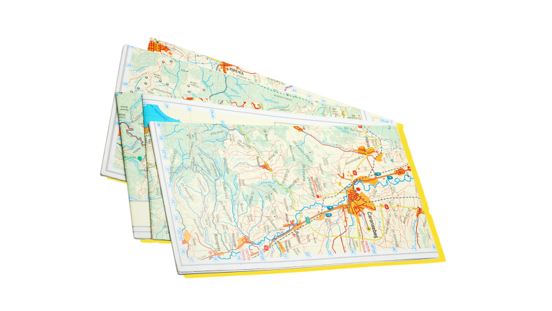 Three paper geographic maps for direction.